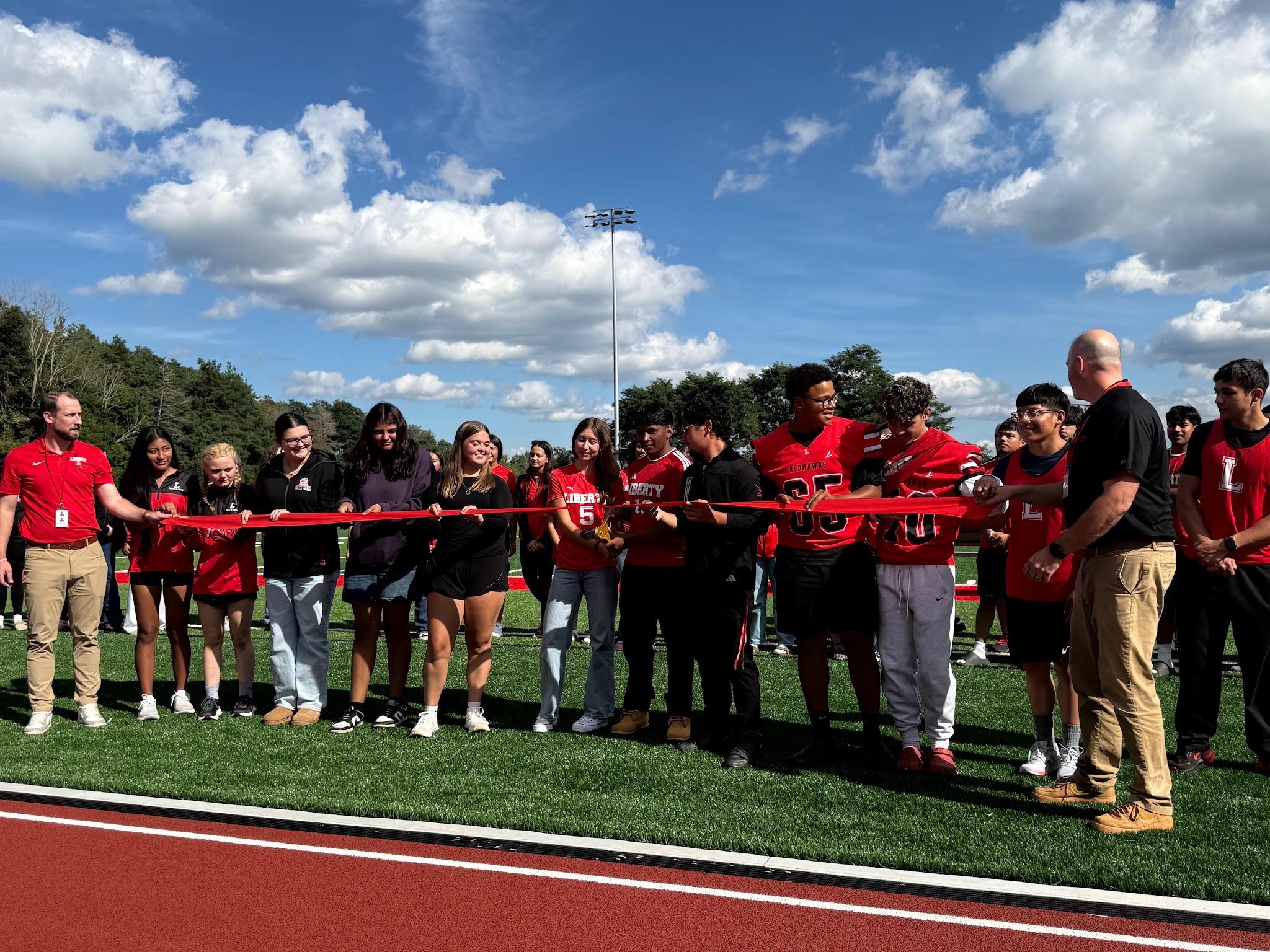 Group of students with red ribbon