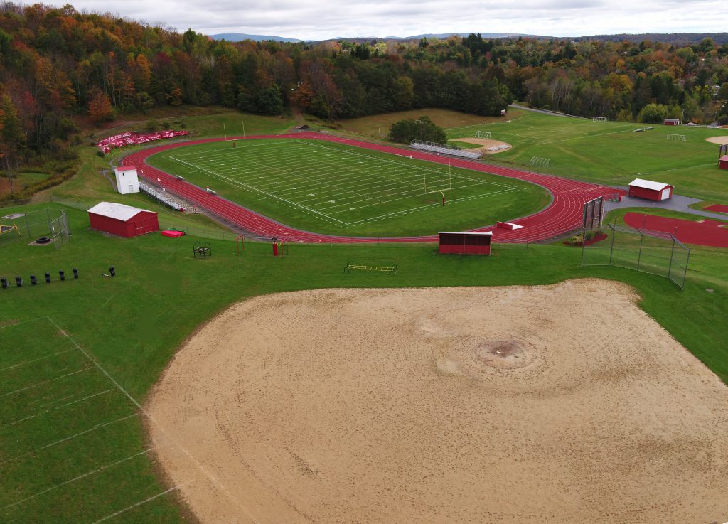 An aerial view of a baseball field and track