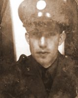 A sepia toned photo of a young soldier in uniform