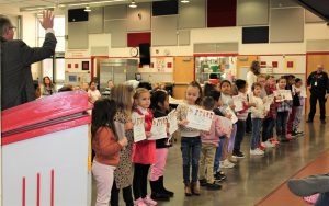 Students hold award certificates