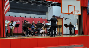 Members of the elementary band perform on stage
