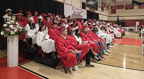 Graduates seated on risers