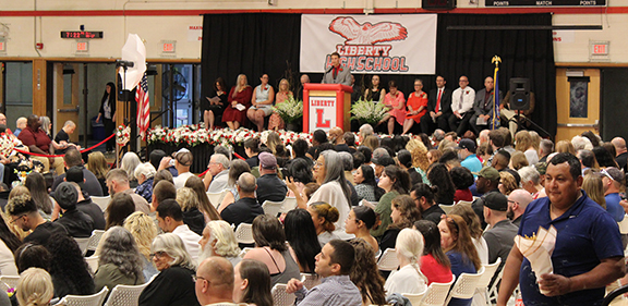 A man speaks at graduation