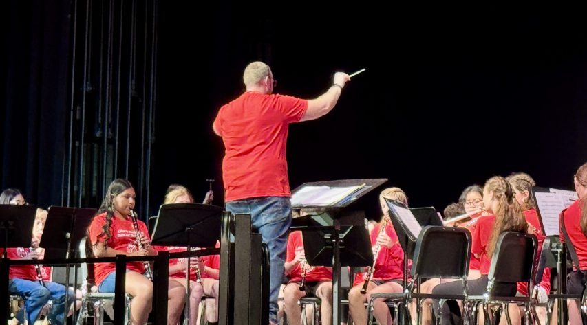 A director instructs a band