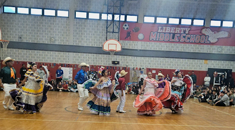 Mexican dancers perform in the gymasium