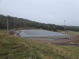 Work continues on the athletic field with the subsurface laid.