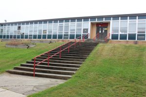 stairs lead to a school building