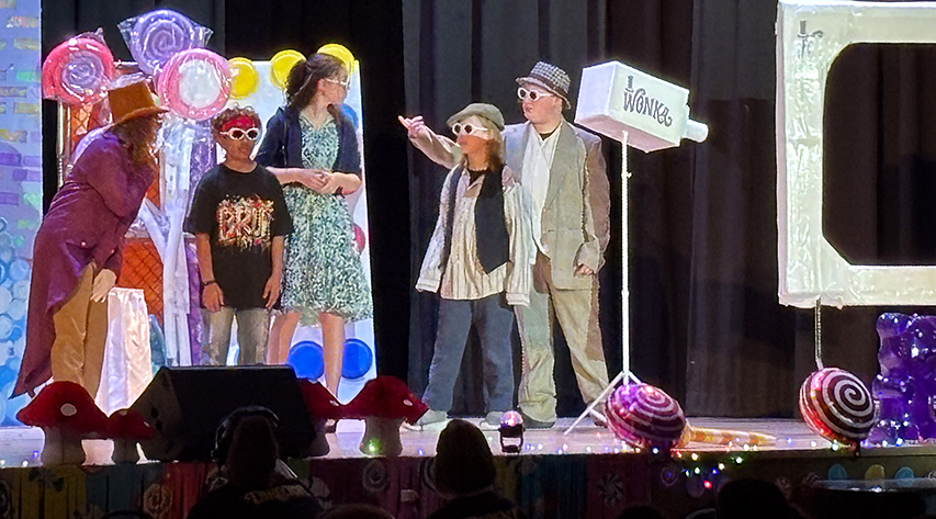 Students act out a scene from Willy Wonka Jr.