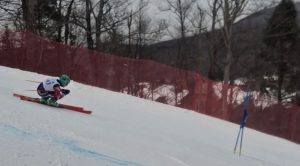 A student skis down a hill