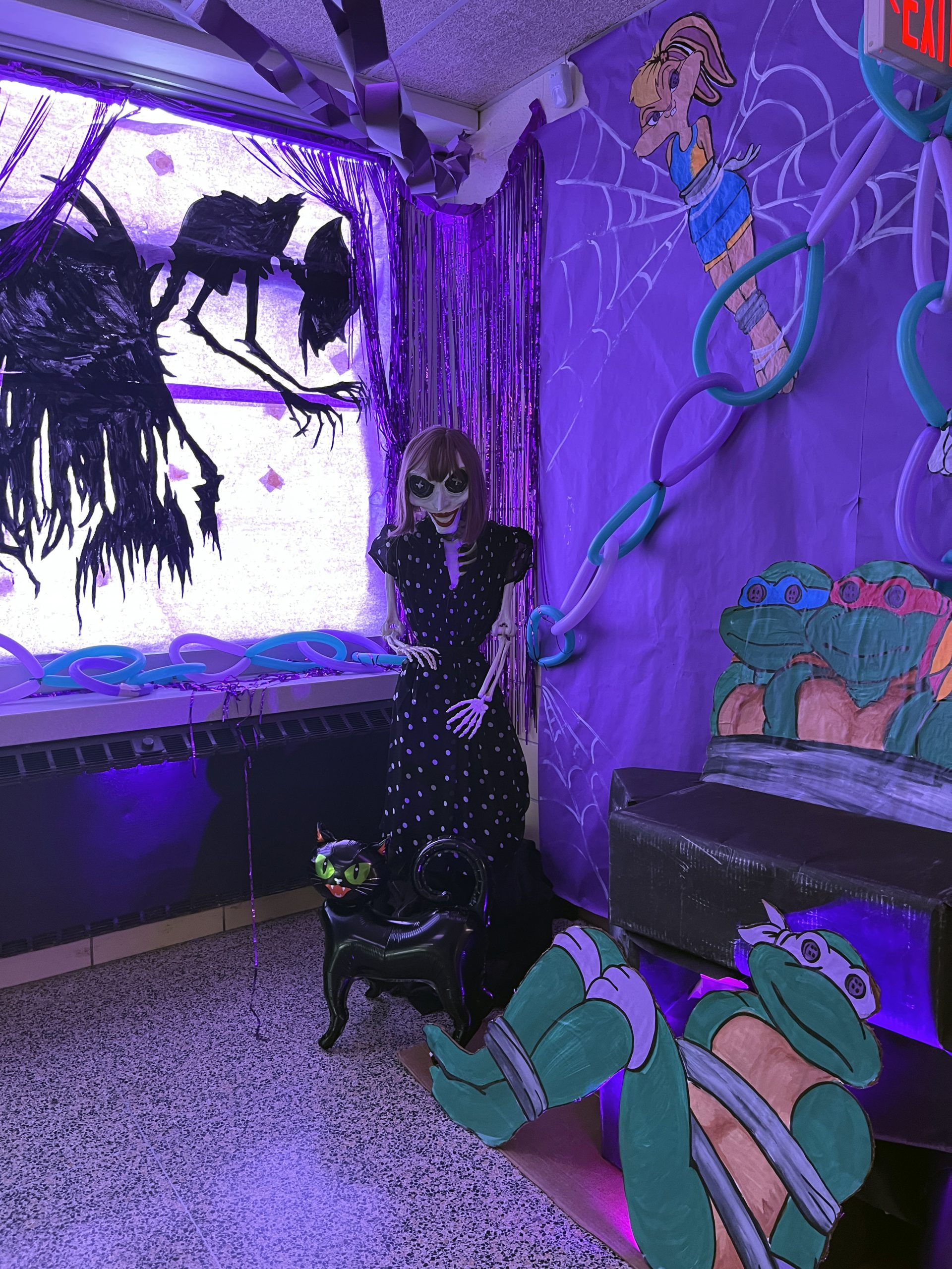 class of 2026-hallway-scene2 A hallway is decorated in a Coraline theme using characters from other class themes