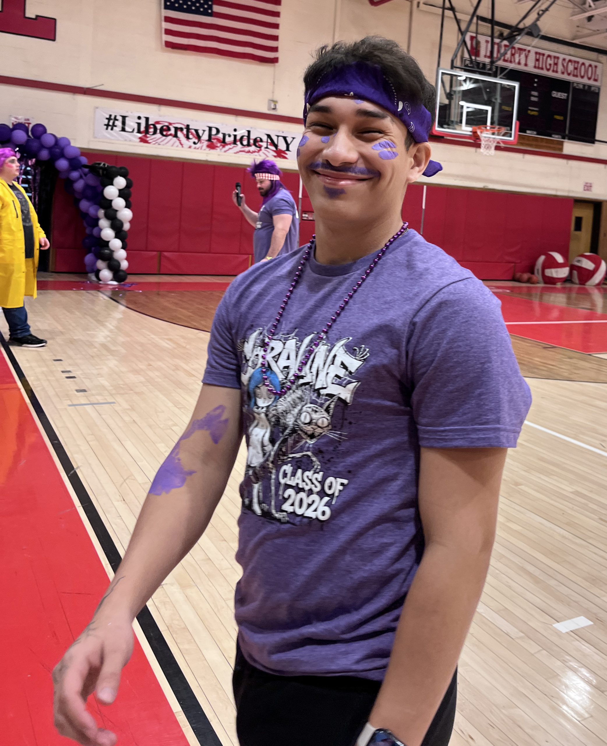 class of 2026-student A student is dressed in a Class of 2026 "Coraline" shirt with purple spots on his face