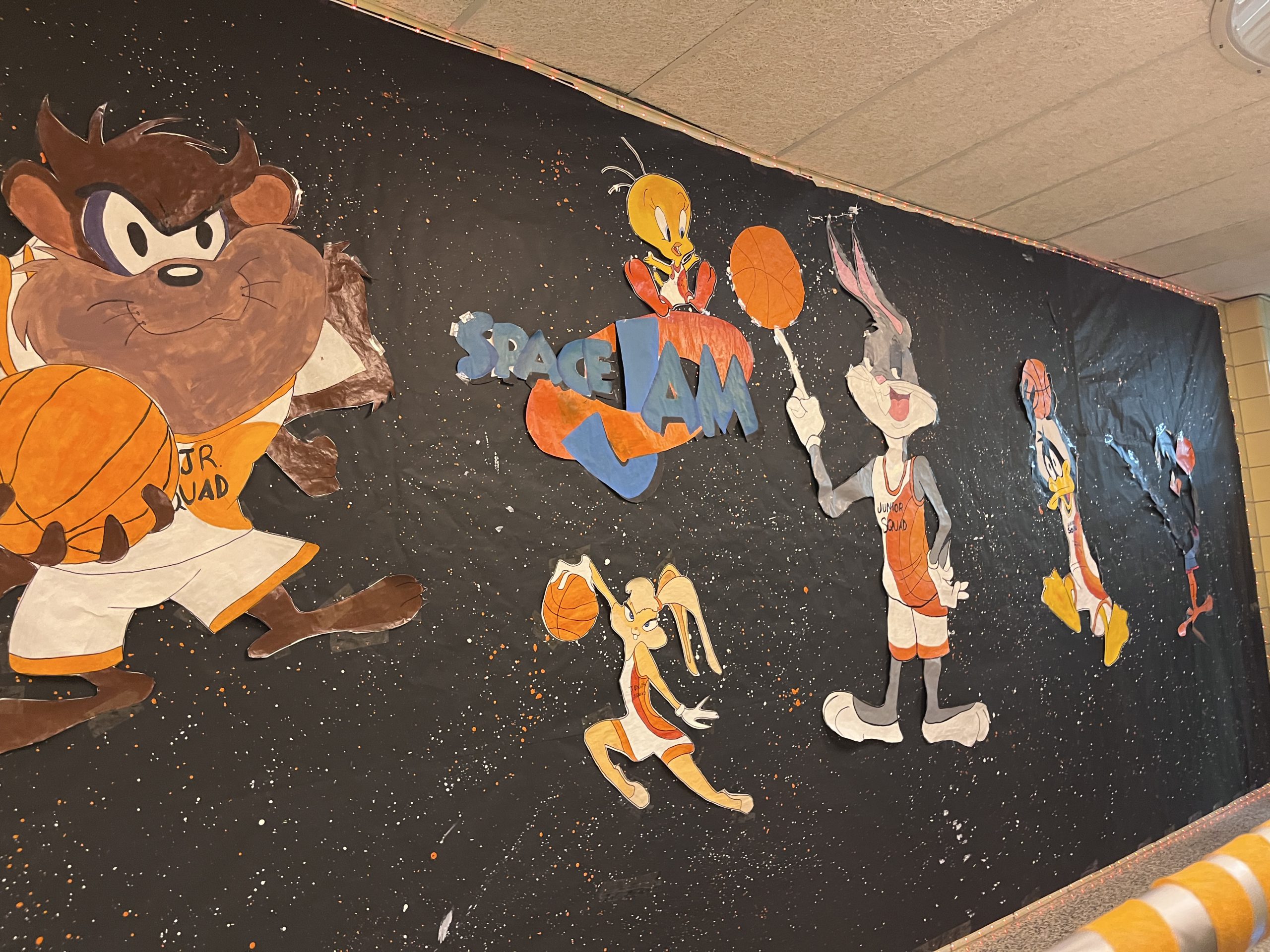 class of 2027-hallway-characters Characters from Space Jam are on a billboard