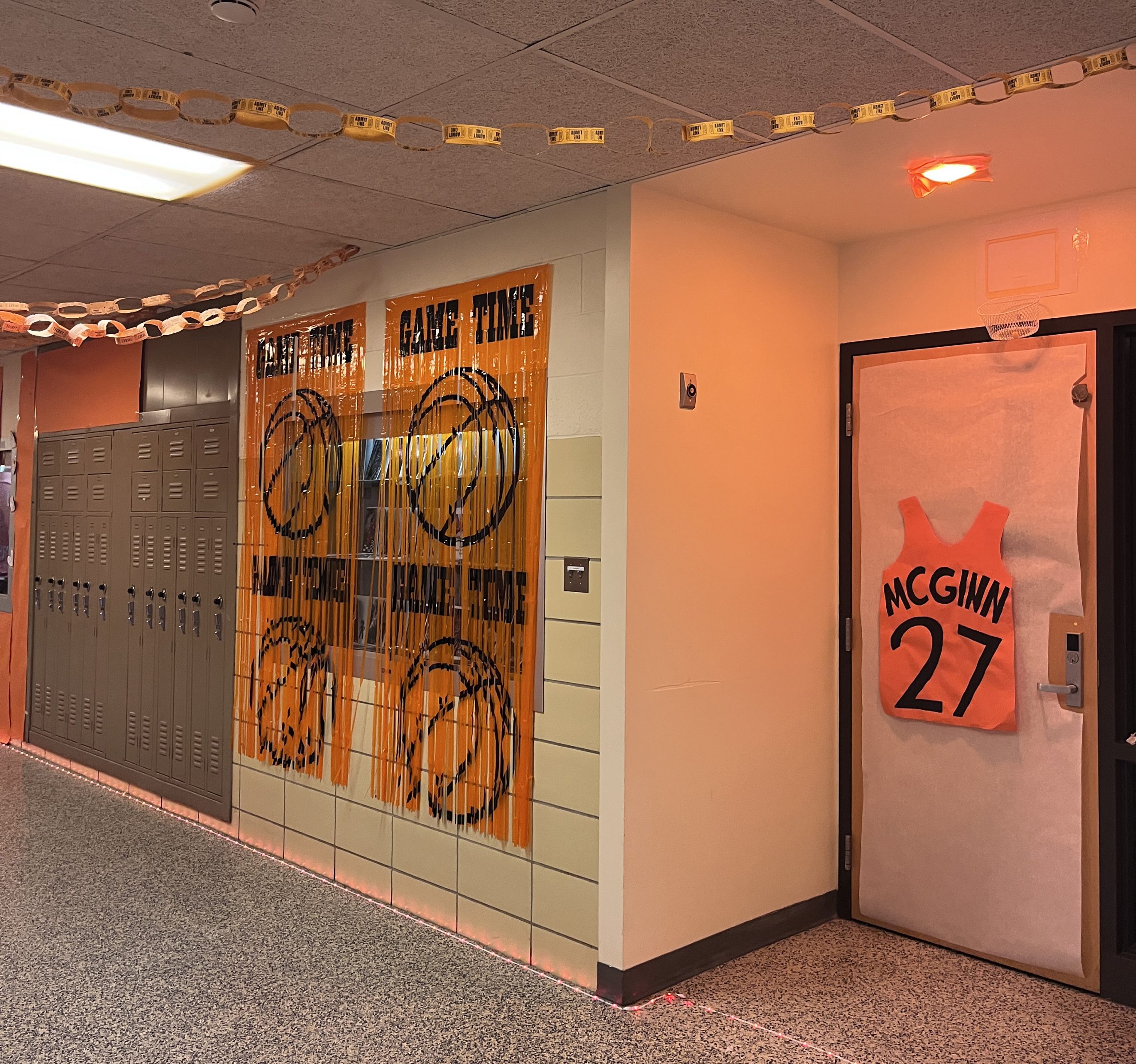 class of 2027-hallway-doors A door and hallways are decorated in Space Jam basketball items