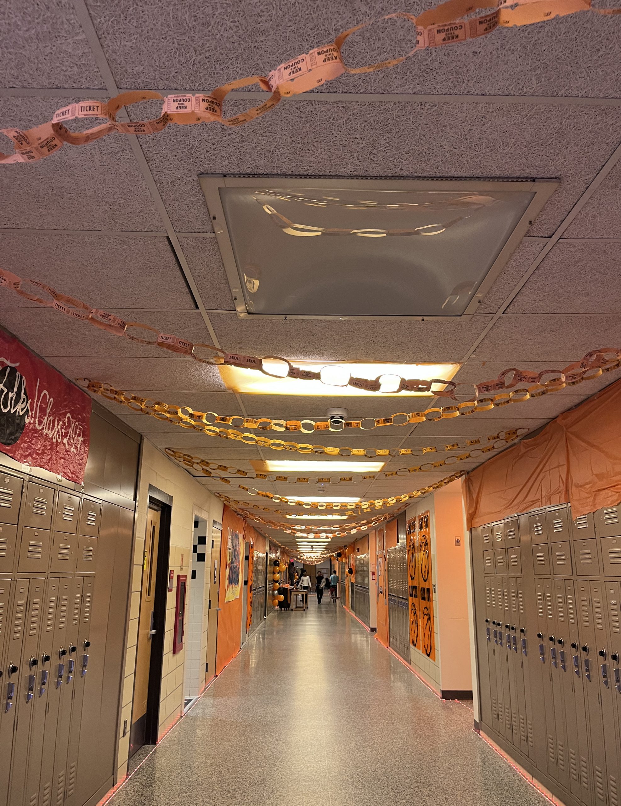 class of 2027-hallway A hallway is decorated in orange in a Space Jam theme.