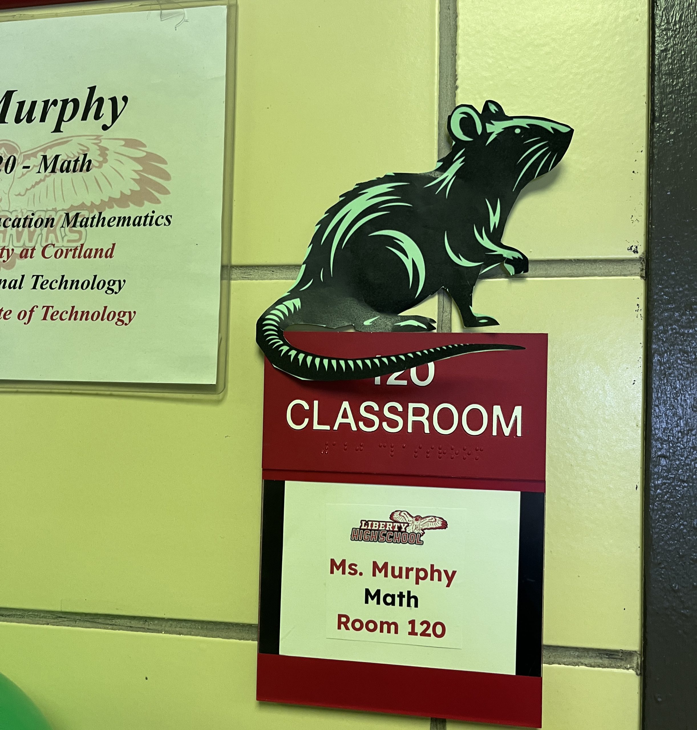 class of 2028-hallway-rat a drawing of a rat is placed above Mrs. Murphy's door placard.