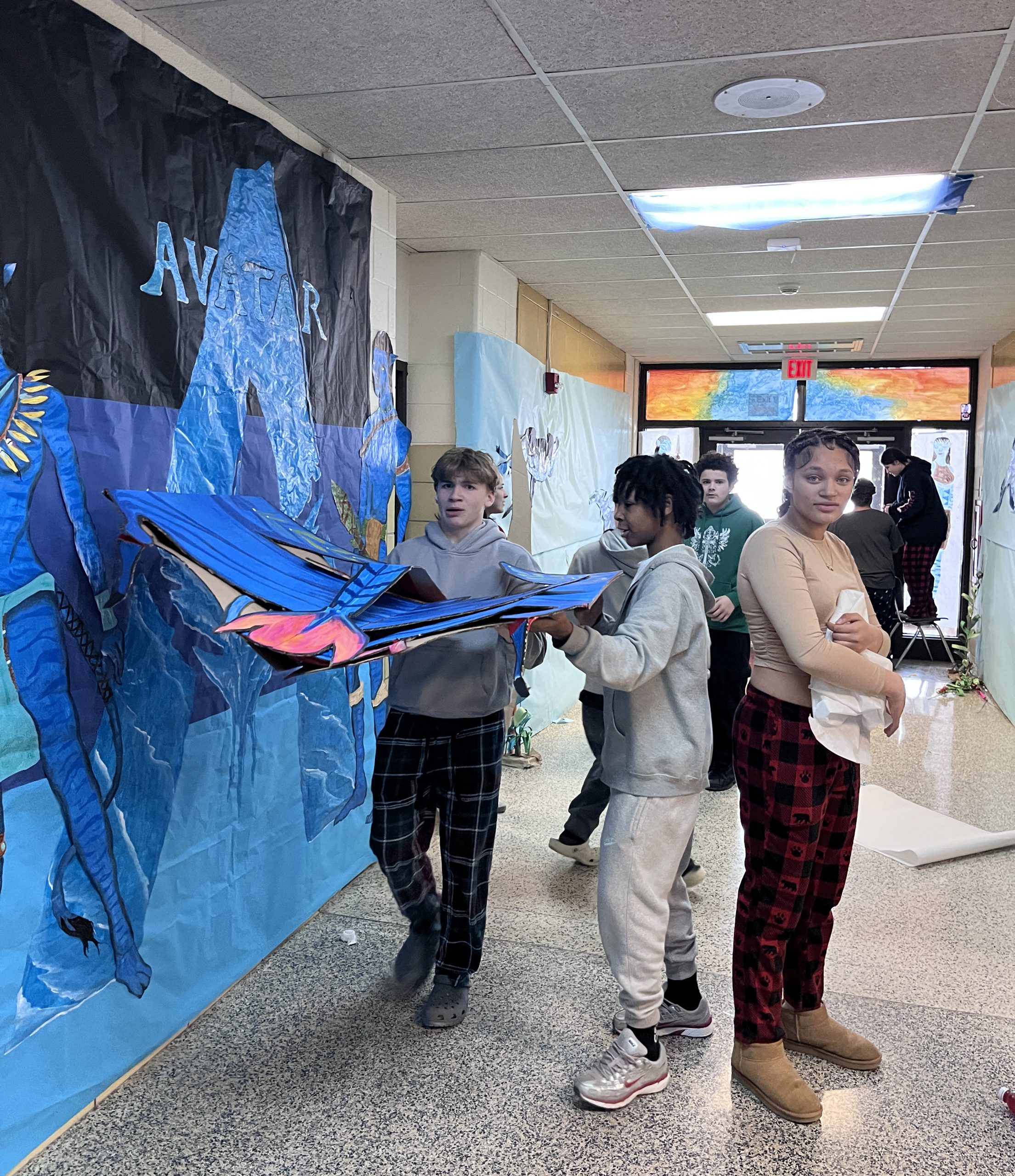 class of 2029 -hallway-decorating Students decorate a hallway in a blue Avatar theme.