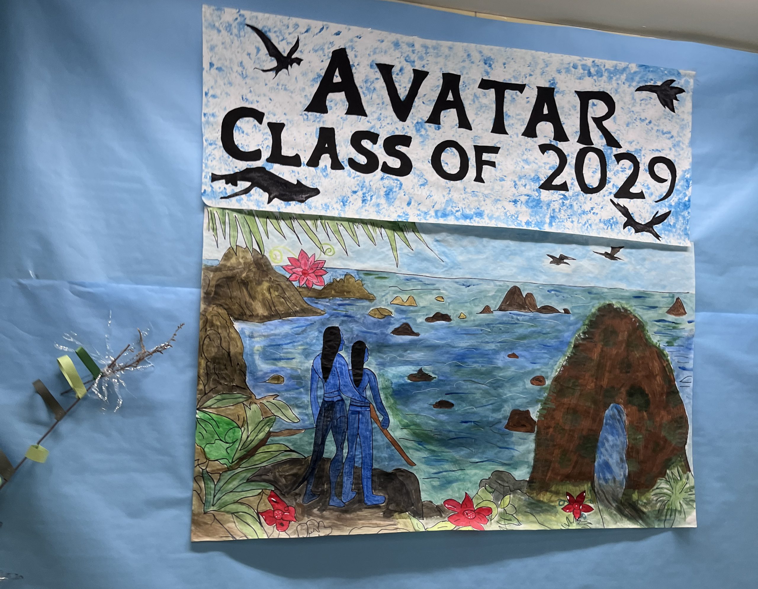 class of 2029 -hallway-sign A scene from avatar is pained on a board with Avatar Class of 2029 written above it.