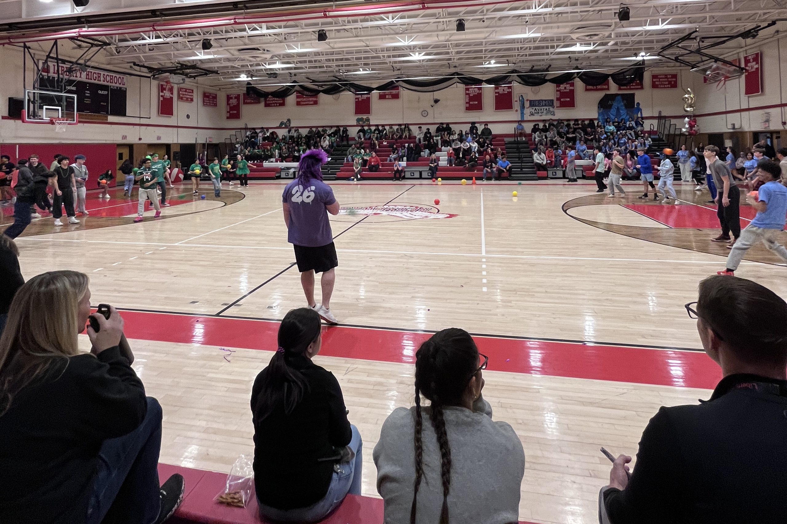 color wars-dodgeball Students in green t-shirts prepare to face off in students in green T-shirts in dodge ball