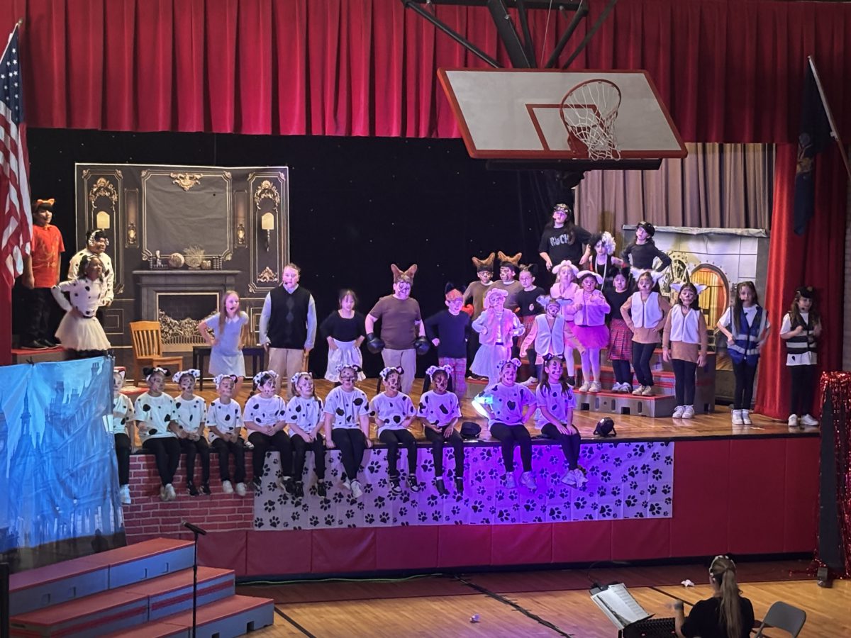 Students perform 101 Dalmatians on stage