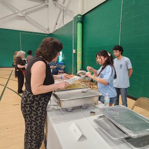 Student serve food buffet style