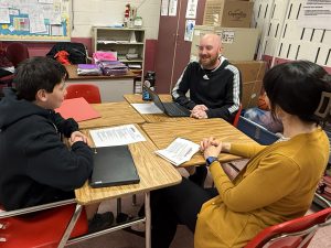 A student talks about his work with his family and a teacher