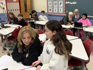 Students show their families their work during the student-led conferences at Liberty Middle School.
