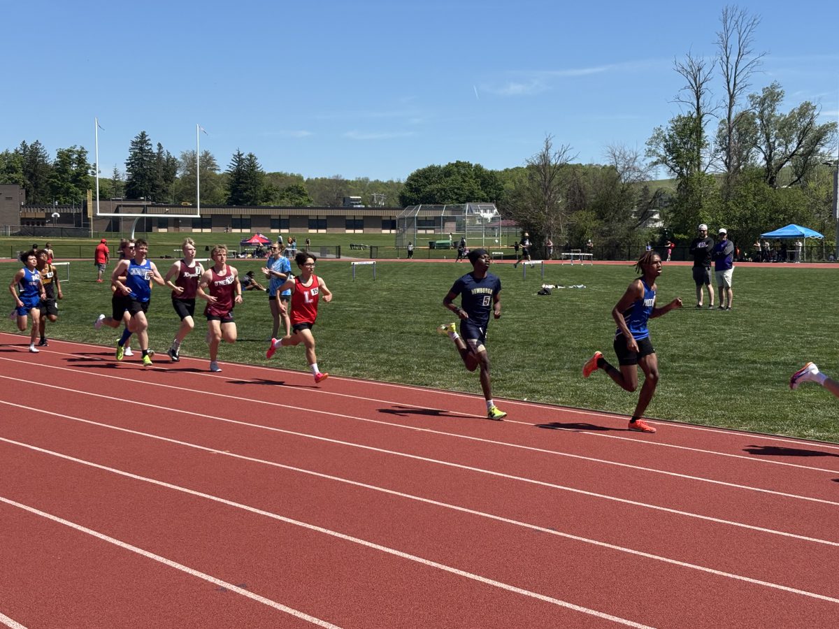 Runners race on a track