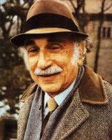 dr irvin borish, alumni of liberty and honoree of wall of fame, wearing hat and suit jacket with tie, smiling toward camera