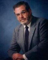 lawrence stier, alumni of liberty and honoree of wall of fame, professional photo, wearing suit and tie, posing for camera