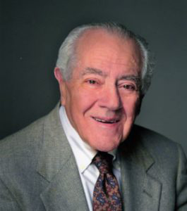 thomas nickou, alumni of liberty and honoree of wall of fame, professional photo, wearing suit and tie, smiling facing camera