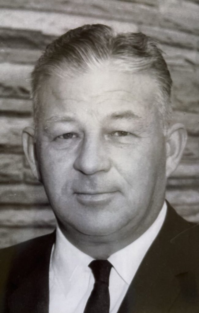 robert bruce travis, alumni of liberty and honoree of wall of fame, sepia toned photo, suit and tie, facing camera